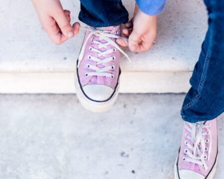 girl tying pink shoes Motherly