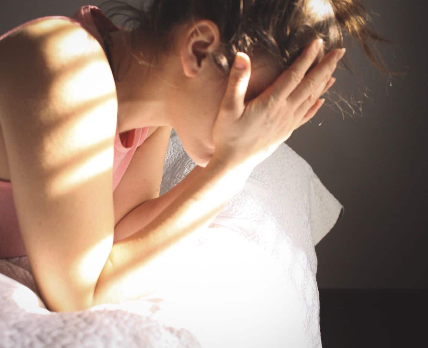 upset woman head in hands