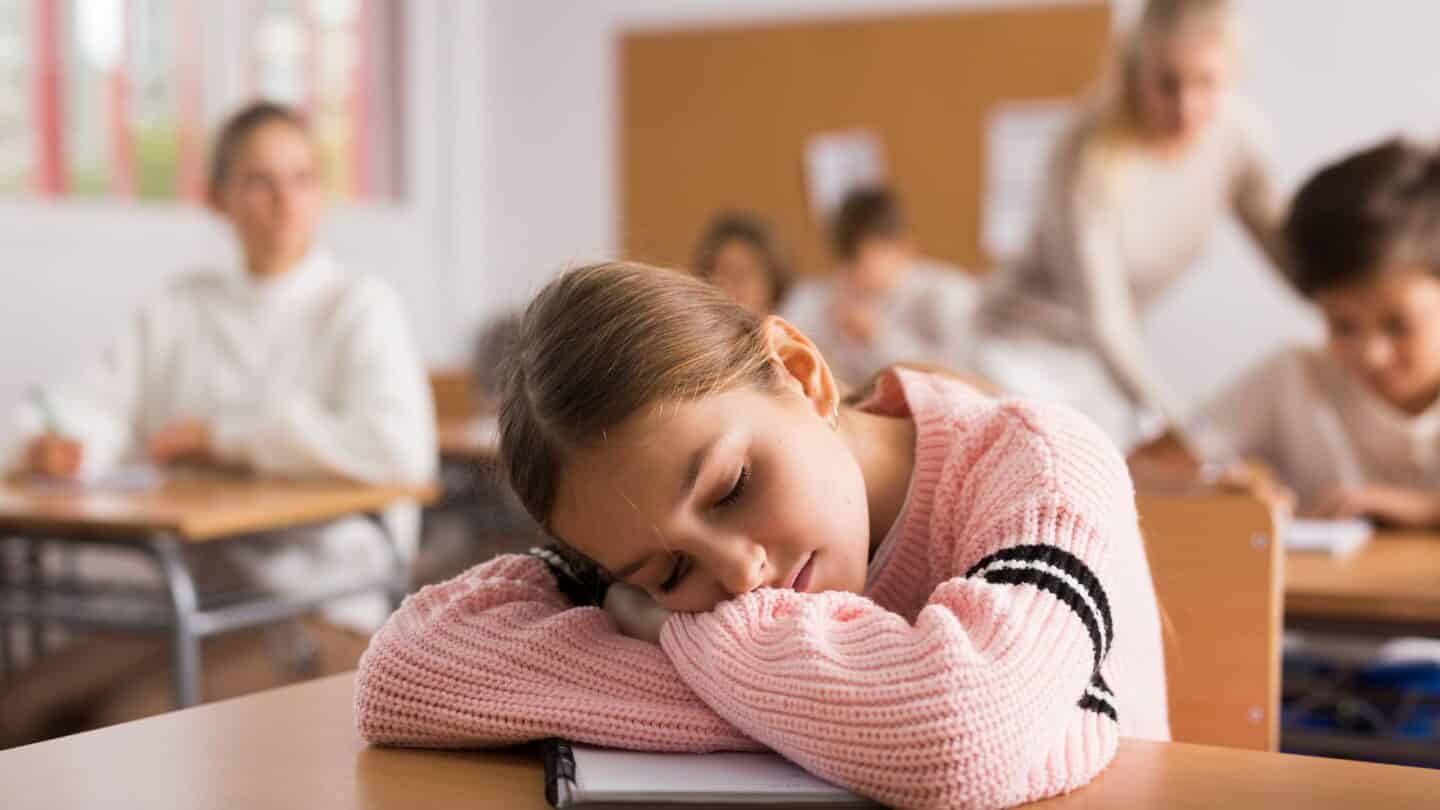 a person sleeping in class