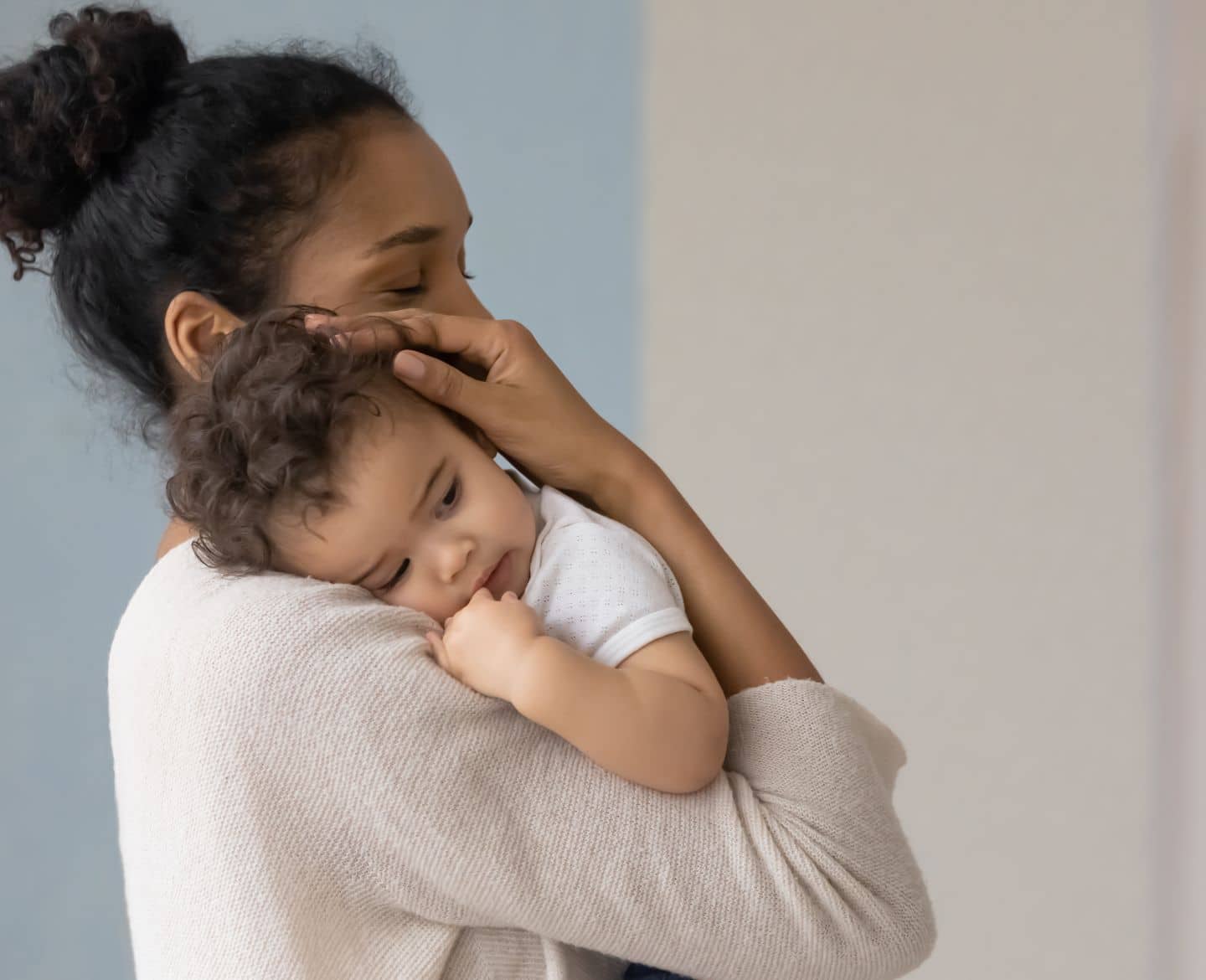 mom holding toddler