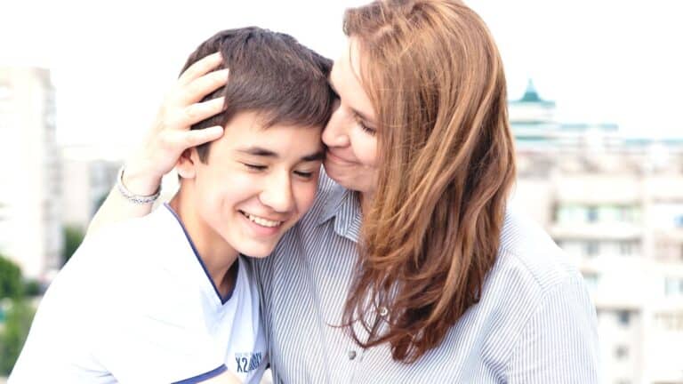 mom embracing teenage son in a display of how parenting styles can act as substance abuse prevention