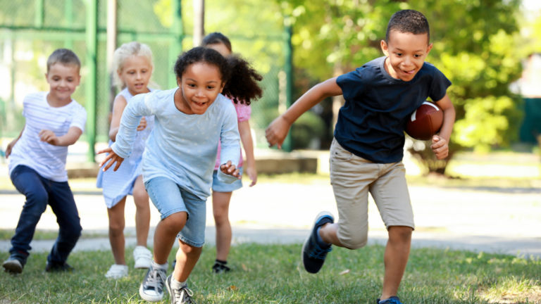 kids running on a playground - how to get kids excited about sports