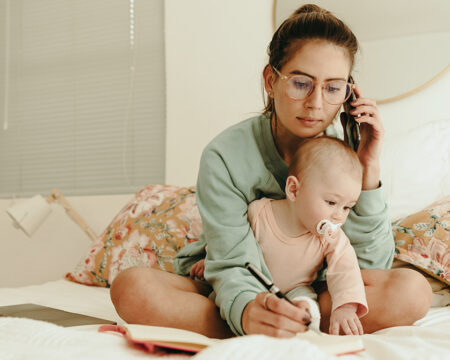 mom taking a phone call while working from home