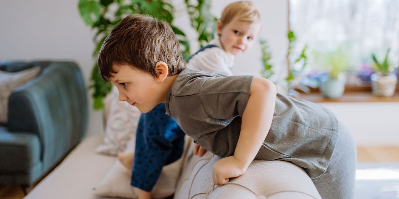 https://www.mother.ly/wp-content/uploads/2022/11/siblings-playing-on-the-couch.jpg