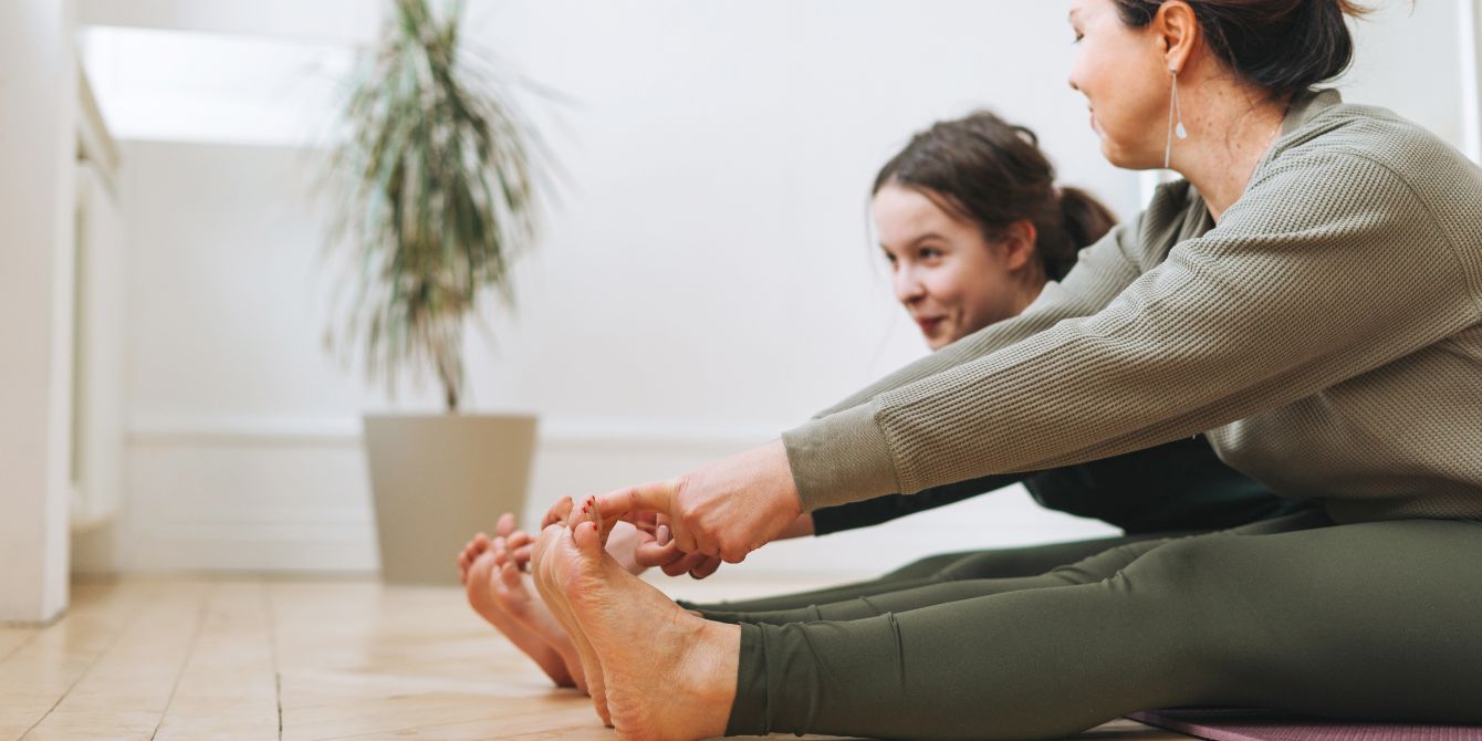 mother and daughter exercise together - childhood obesity