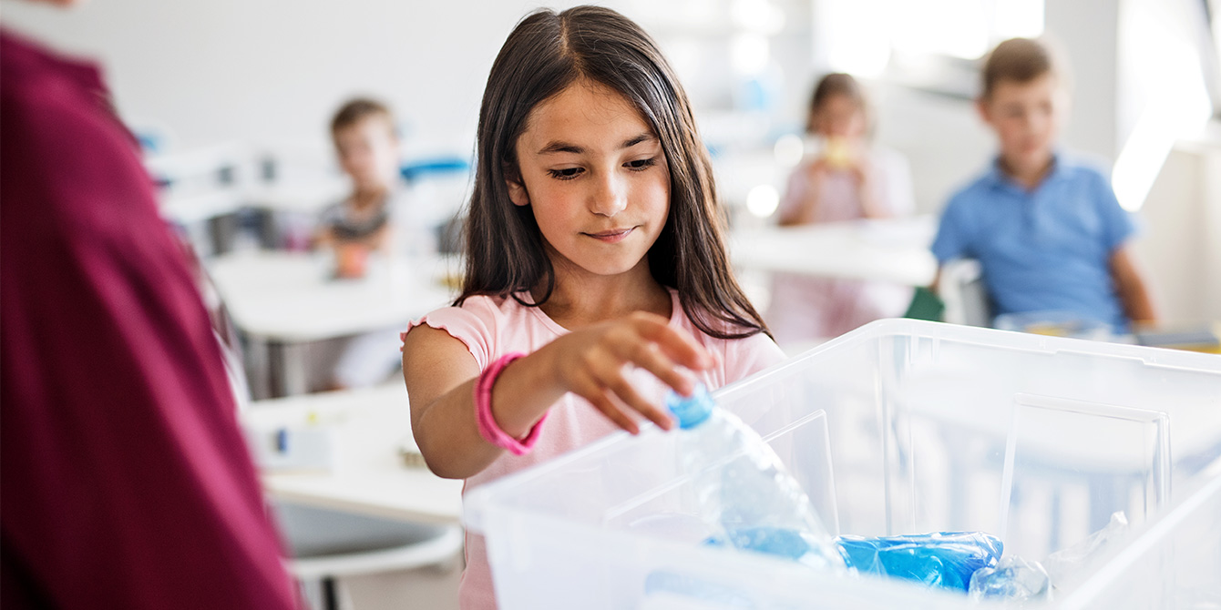 school child learning about recycling and reducing food waste