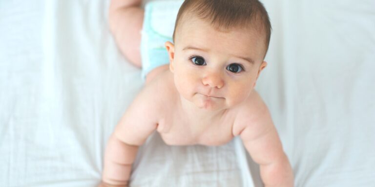 baby pushing up on arms during tummy time - 5-month-old baby weight