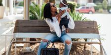 Mom holding baby on bench