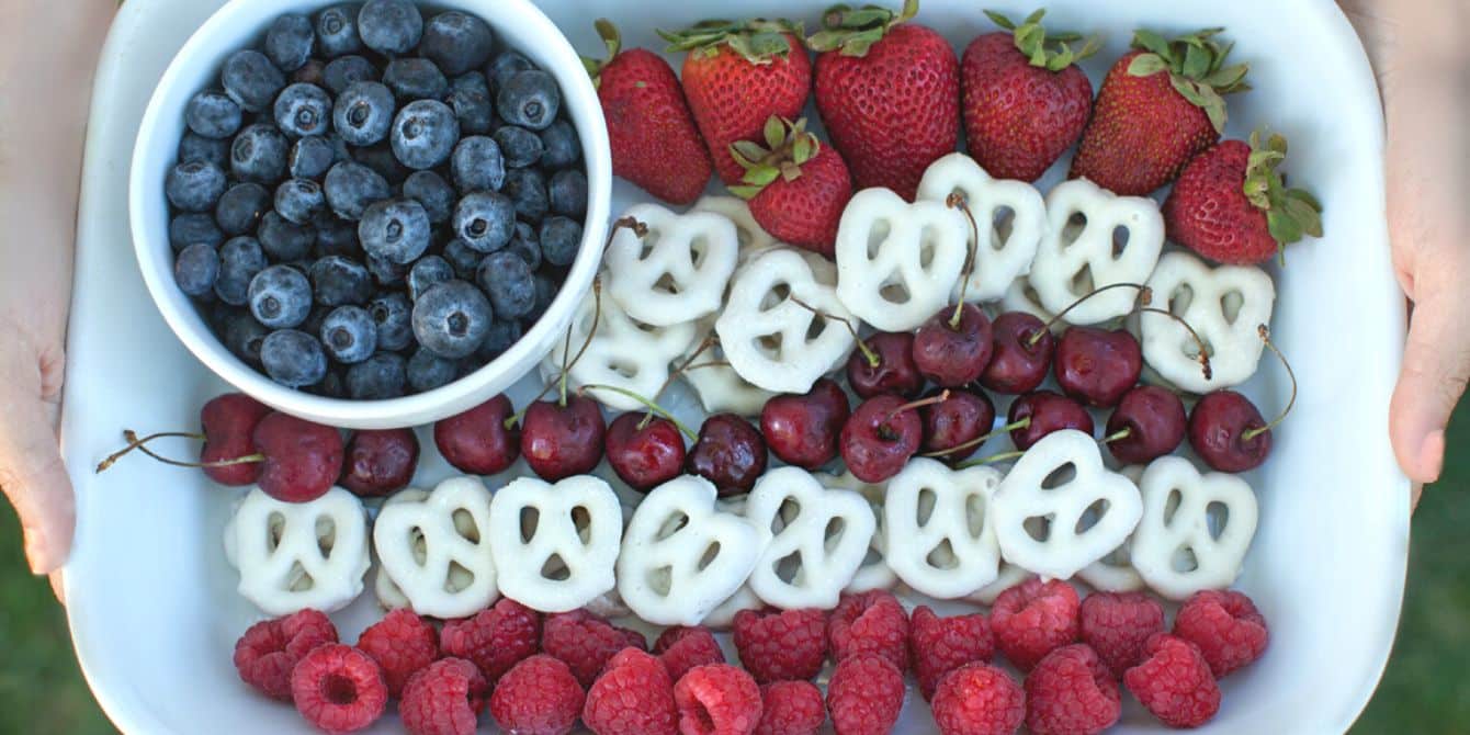 https://www.mother.ly/wp-content/uploads/2023/04/festive-patriotic-snack-blueberries-strawberries-cherries-white-chocolate-pretzels.jpeg