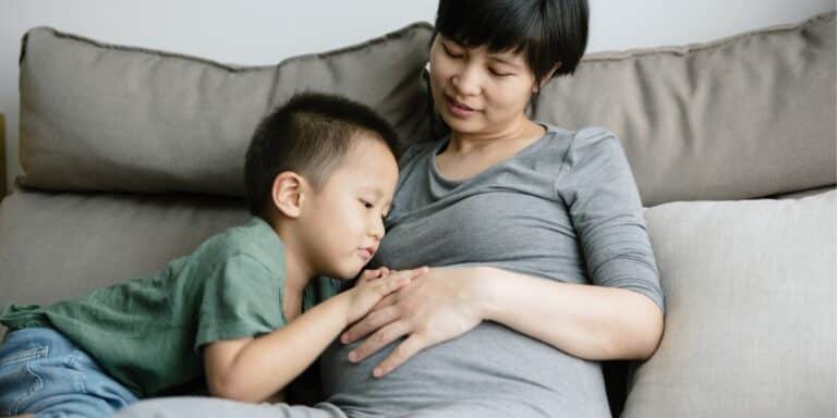 boy with pregnant mom- top stories on life with two kids