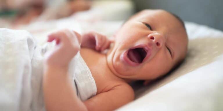 newborn baby yawning - vaginal seeding