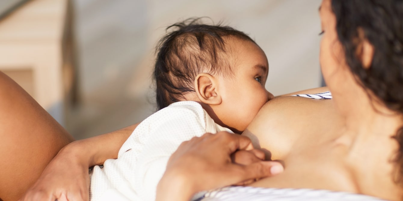 young black mother breastfeeding her baby - lactation coverage gap