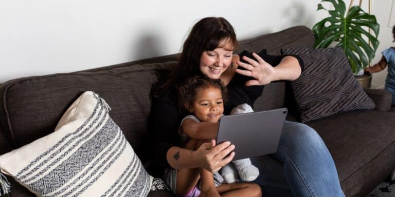 mother and daughter on video call - screen free