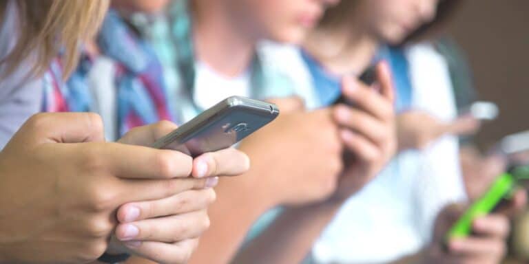 Kids on their phones at school