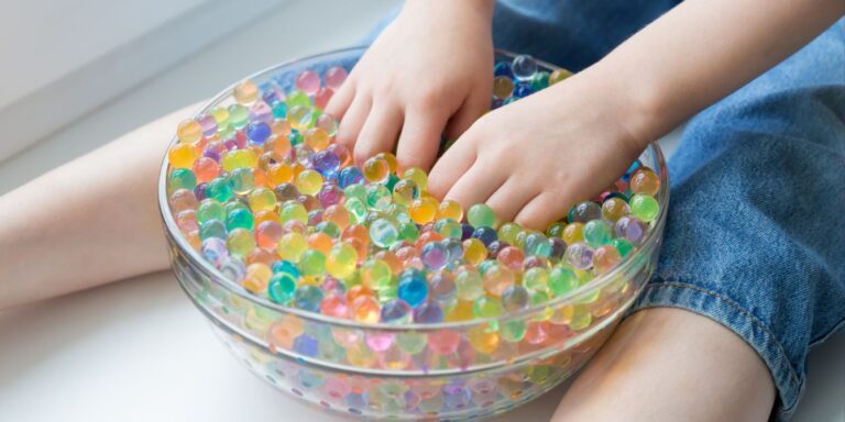 Child playing with water beads