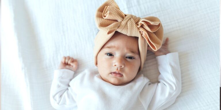 Baby wearing a bow headband