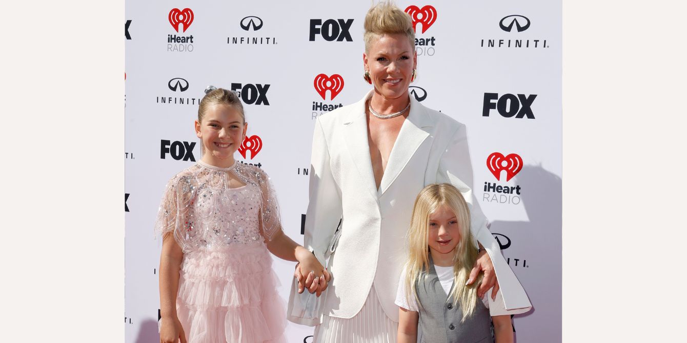 Pink poses with her children on a red carpet