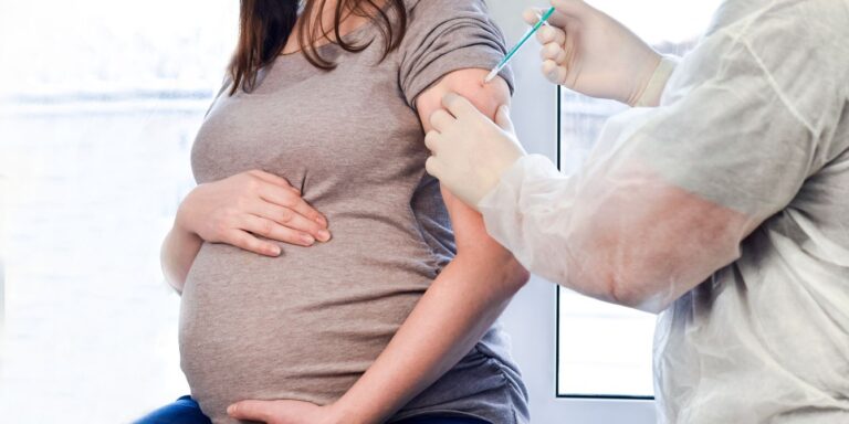 pregnant woman getting vaccine - effects of covid vaccine in pregnancy on newborns