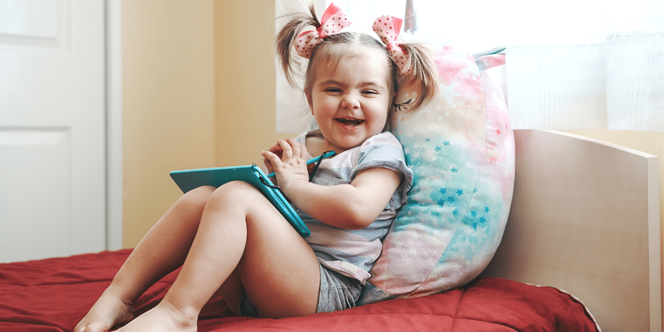 https://www.mother.ly/wp-content/uploads/2023/10/smiling-toddler-baby-girl-drawing-with-stylus-on-digital-drawing-pad-tablet.png