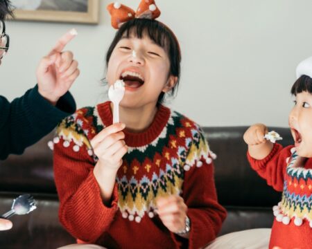 https://www.mother.ly/wp-content/uploads/2023/11/family-playing-together-during-holiday-season-450x360.jpeg