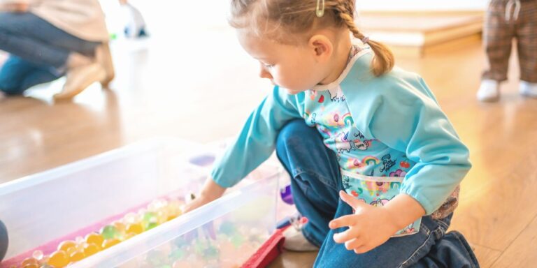 Girl playing with water beads