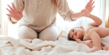 Mom and baby on bed