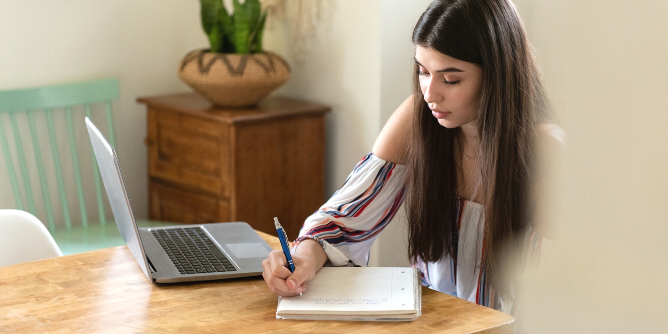 teenage girl doing homework - college admissions tips for parents