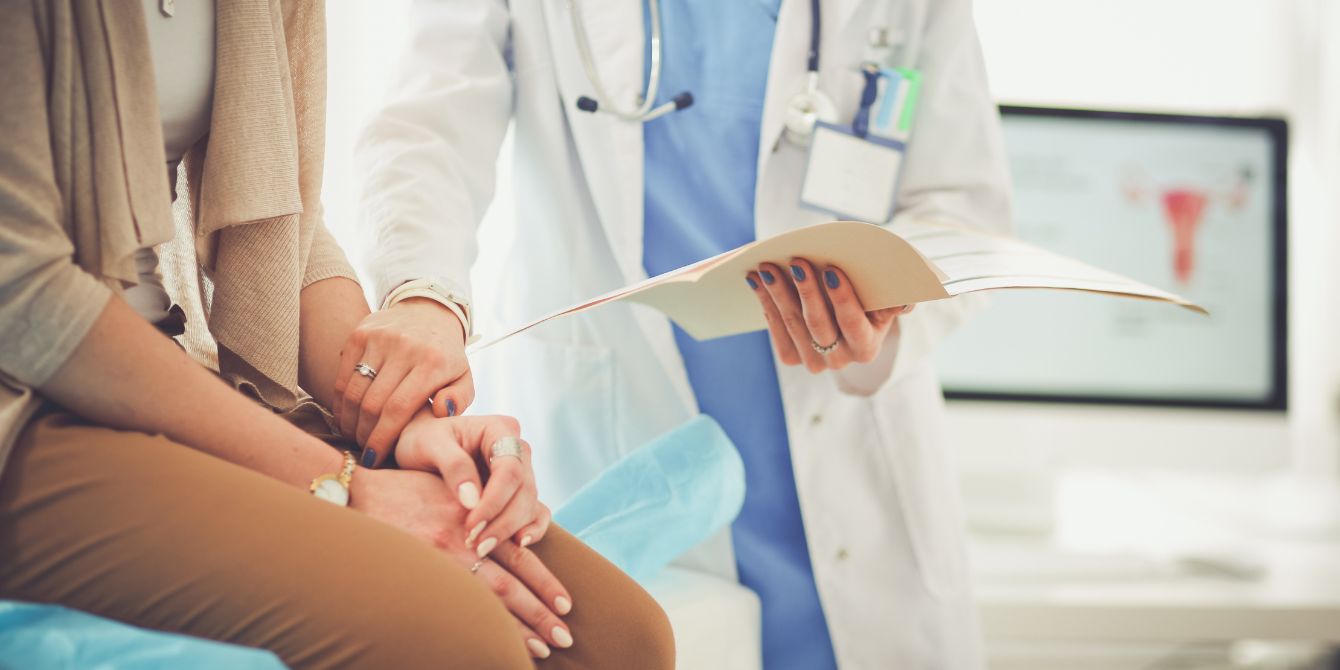 woman at doctors office - close research gender gap