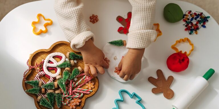 child hands doing Christmas craft holiday activities for kids