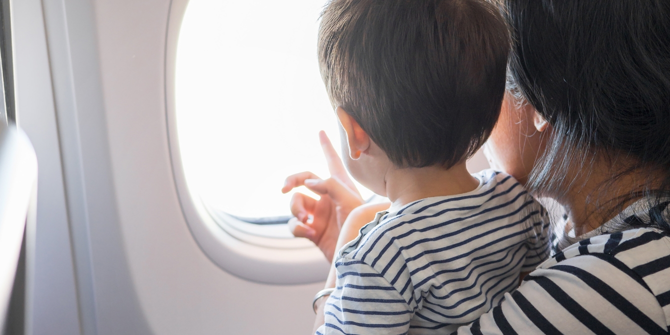 https://www.mother.ly/wp-content/uploads/2023/12/mom-and-toddler-on-airplane.jpeg