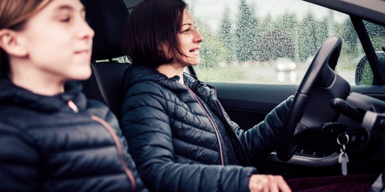 mother and teen daughter driving in car music to shift mindset