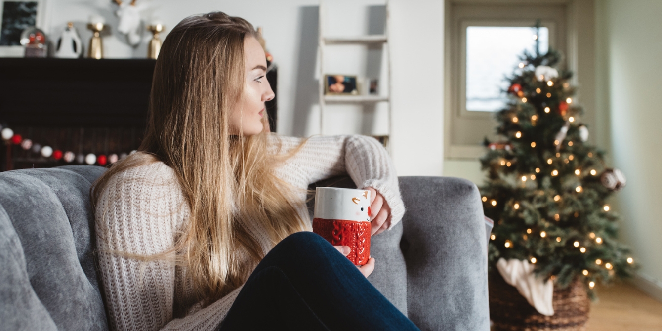 woman sitting on couch looking serious nervous system health