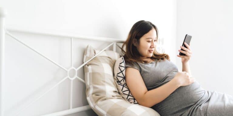 Pregnant woman on phone virtual call