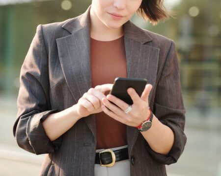 woman checking phone selecting your sperm donor