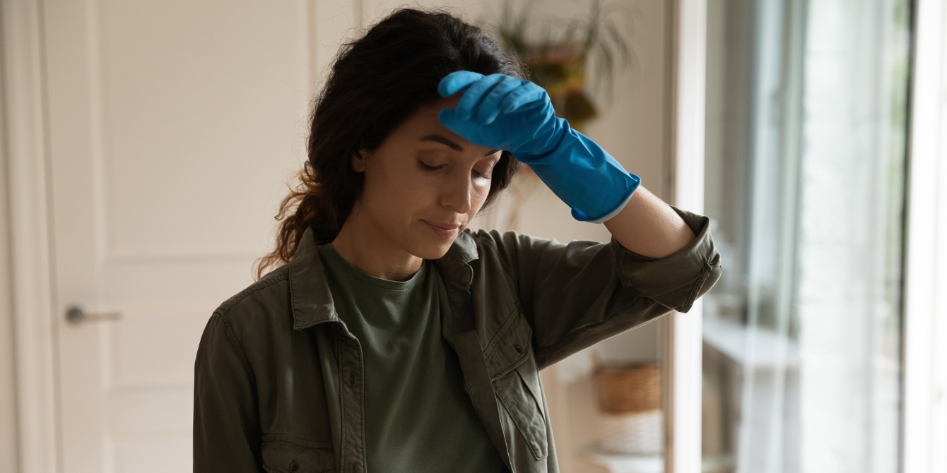 woman cleaning tired- holiday cleanup mental load