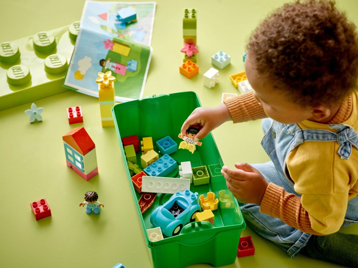 toddler playing with LEGO DUPLO sets