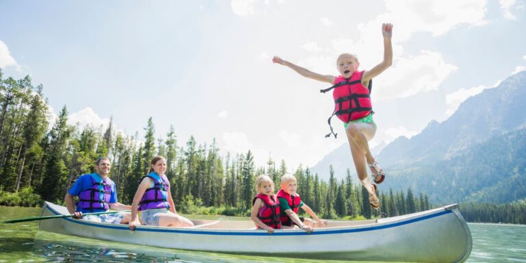 Kids swimming in a lake