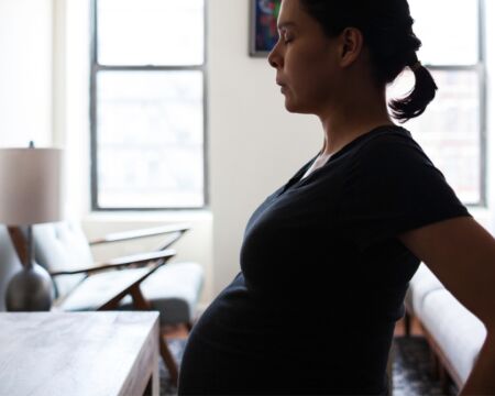 pregnant woman doing breathing exercise Motherly