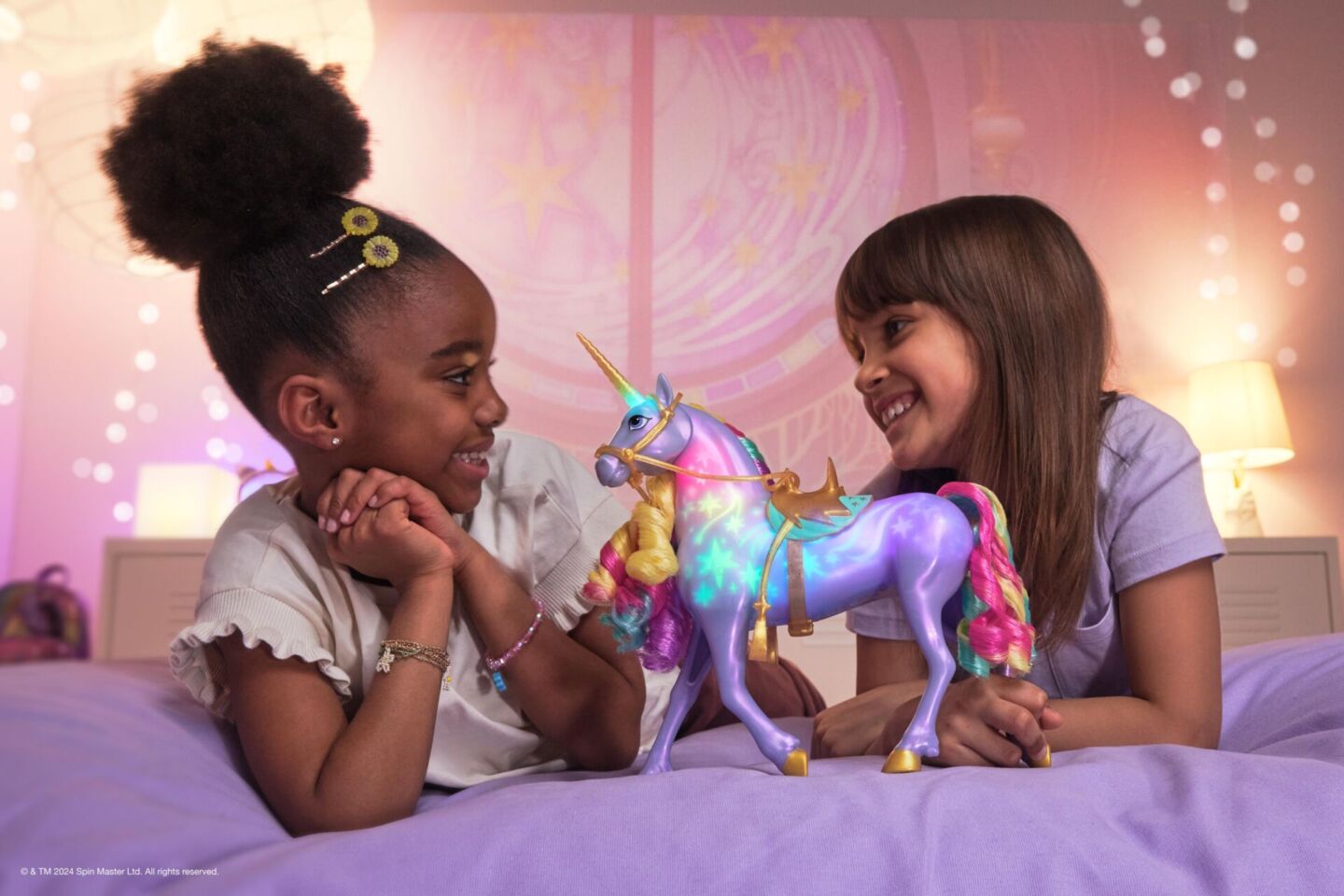 Two girls playing with Unicorn Academy toys