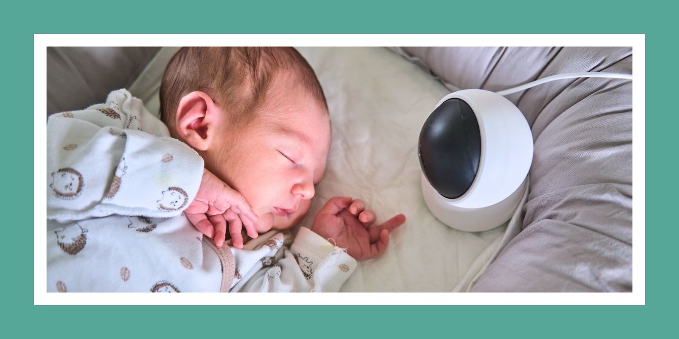 Newborn baby with a monitor