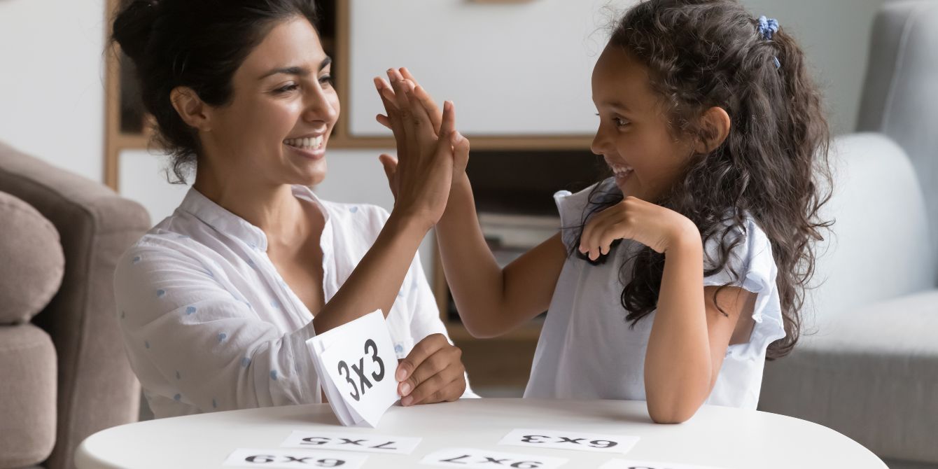 first day of homeschool- mom teaching daughter with flashcards