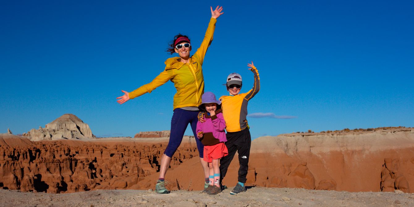 mom and two kids on top of mountain - katy-robin garton adventuring outdoors with kids