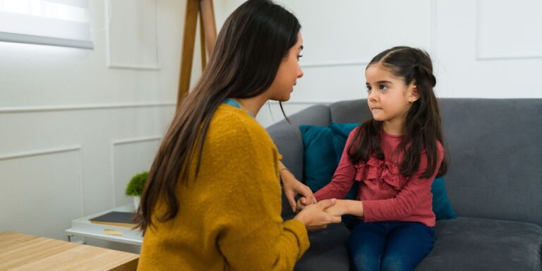 solutions for challenging behavior- mom talking to little girl