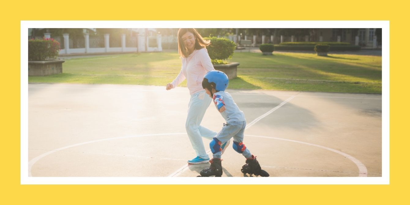 mom holding child's hand while child is skating