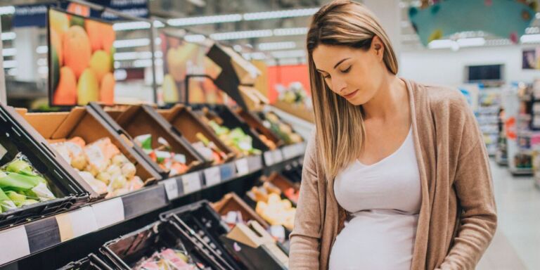 Pregnant woman shopping for food