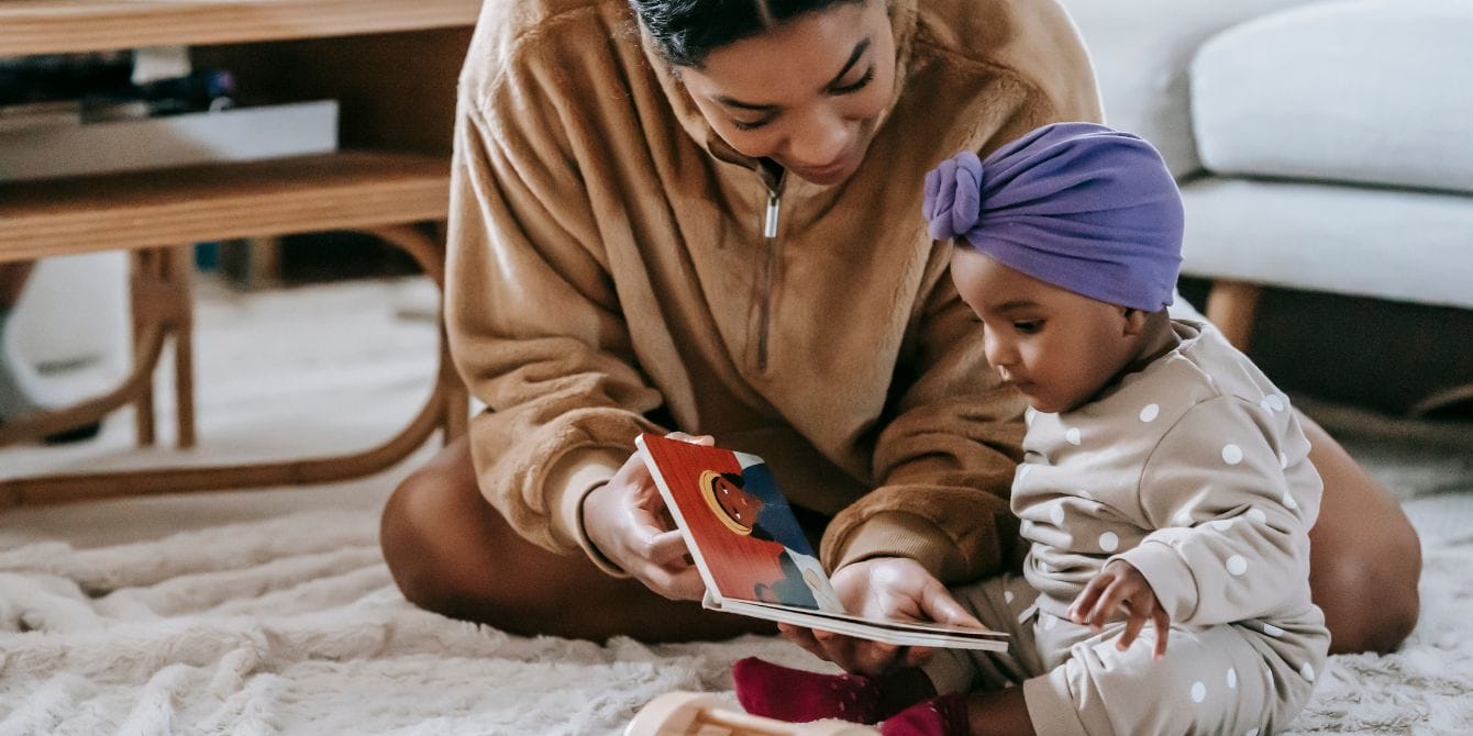 children's books - mom reading to baby