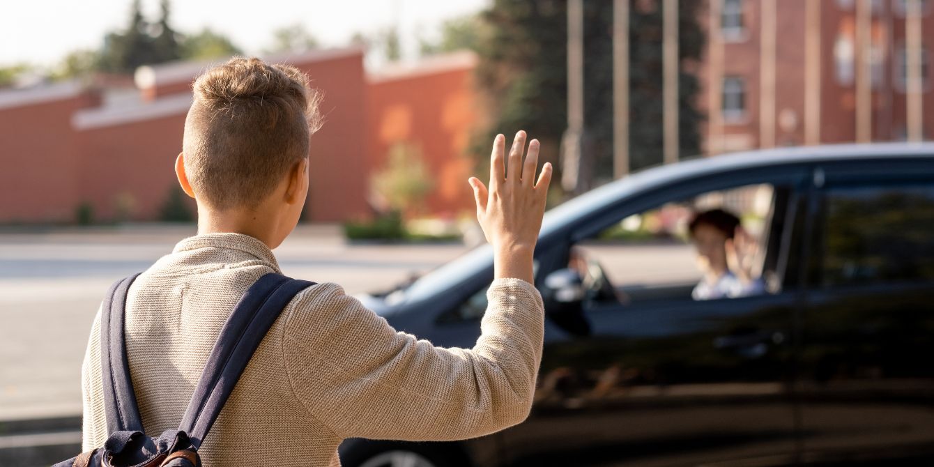 college drop-off - kid waving bye to mom