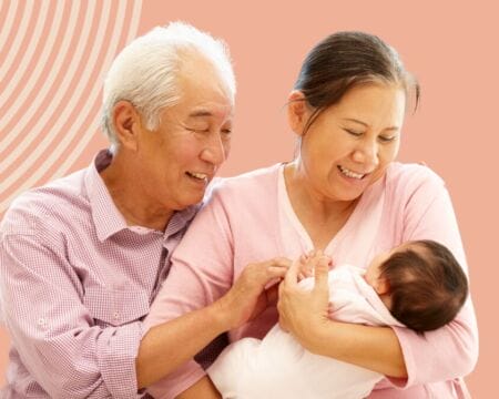 grandparents holding grandbaby Motherly