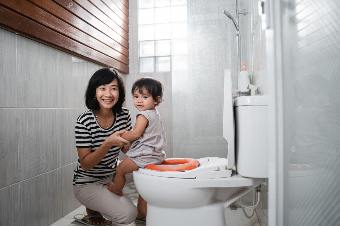 mother and toddler smiling potty training Motherly