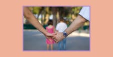 Marriage after kids: A couple holding hands